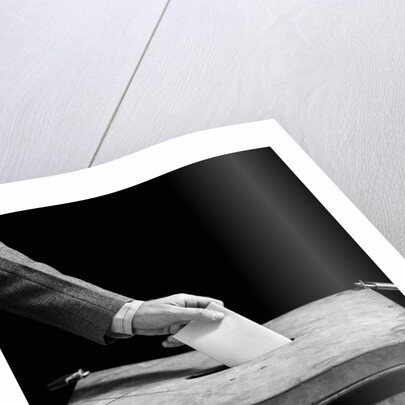1930s 1940s Man's Hand Putting Ballot In Slot In Box by Anonymous