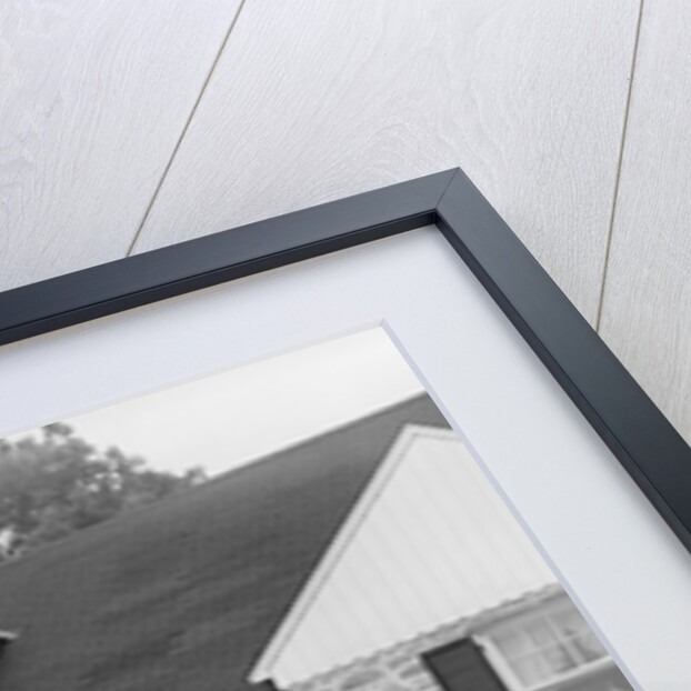 1940s 1950s Couple Standing Outside Looking At Stone Suburban House by Anonymous