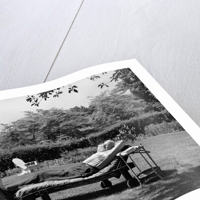 1950s Elderly Man In Backyard Stretched Out On Lounge Chair Under Tree by Anonymous