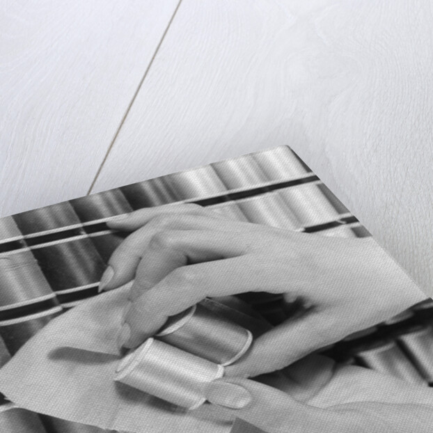 1940s Hand Woman Matching Spool Of Thread To Swatch Of Material by Anonymous