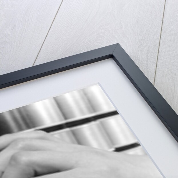 1940s Hand Woman Matching Spool Of Thread To Swatch Of Material by Anonymous