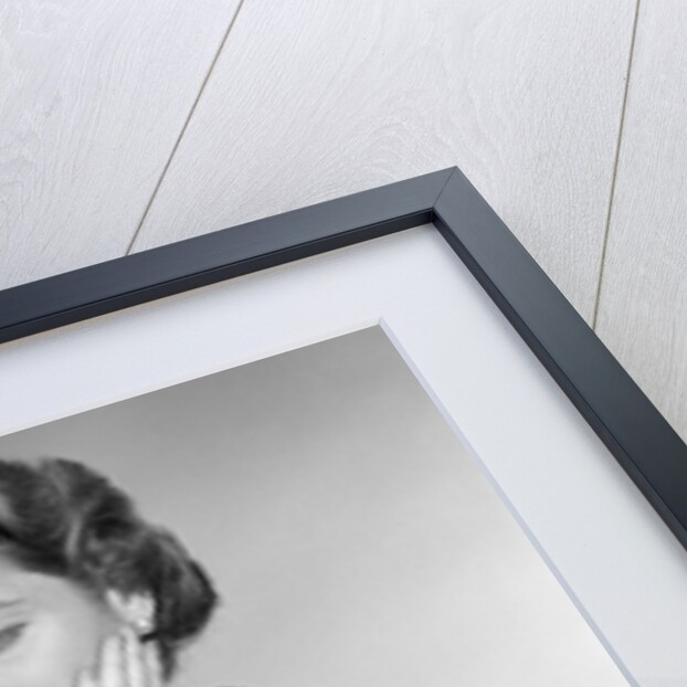 1950s Woman With Exaggerated Expression Hand On Face Looking Inside Her Purse by Anonymous