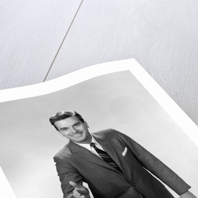 1960s Salesman Or Businessman Leaning Forward Extending Hand For Handshake by Anonymous