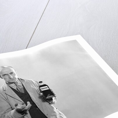 1930s Dour Man In Lab Coat Holding Bottle Of Poison by Anonymous