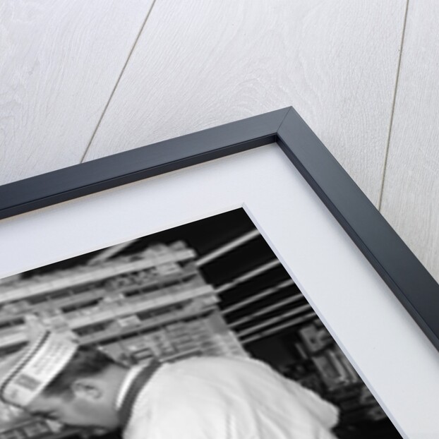 1960s Mother Daughter Unload Grocery Cart At Supermarket Checkout Counter by Anonymous