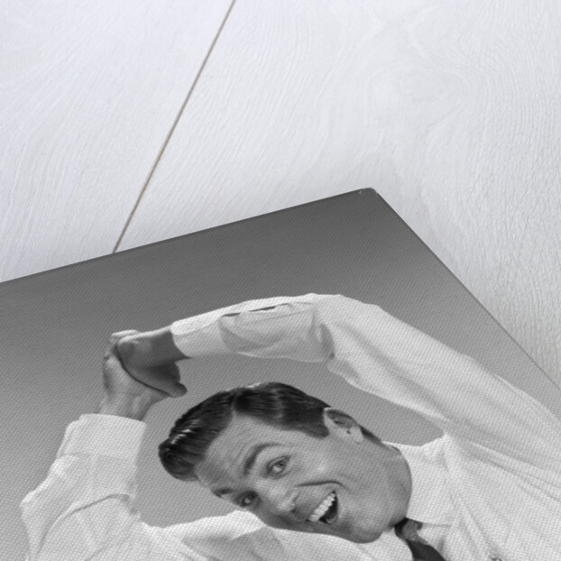 1960s Businessman In Shirtsleeves Clasping Hands Together Overhead by Anonymous