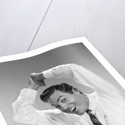 1960s Businessman In Shirtsleeves Clasping Hands Together Overhead by Anonymous