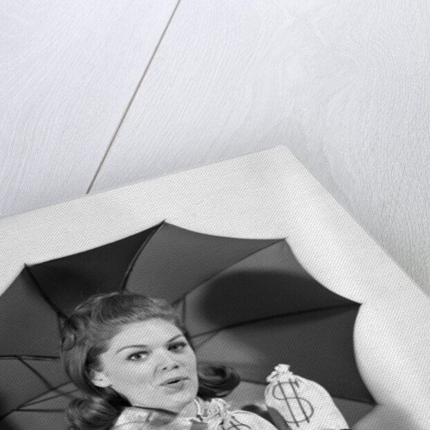 1960s Woman With Umbrella Holding Bags Of Money Save Your Money For A Rainy Day by Anonymous