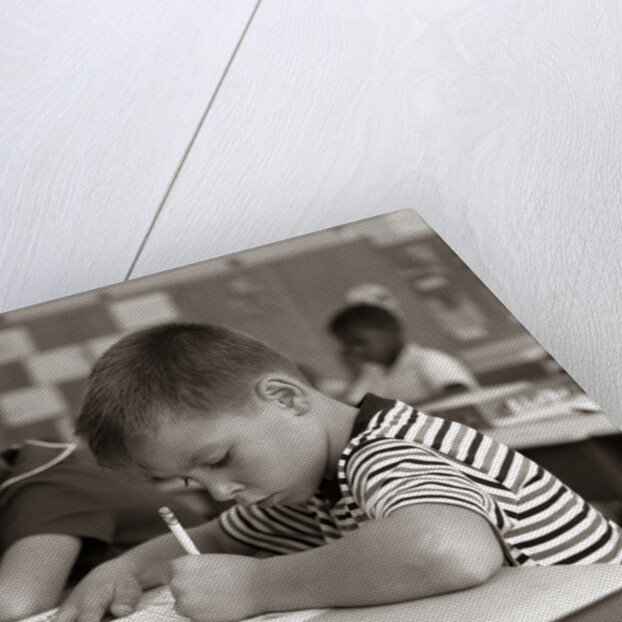 1960s Boy Striped T-Shirt Elementary School Classroom Sitting Desk Writing Test by Anonymous