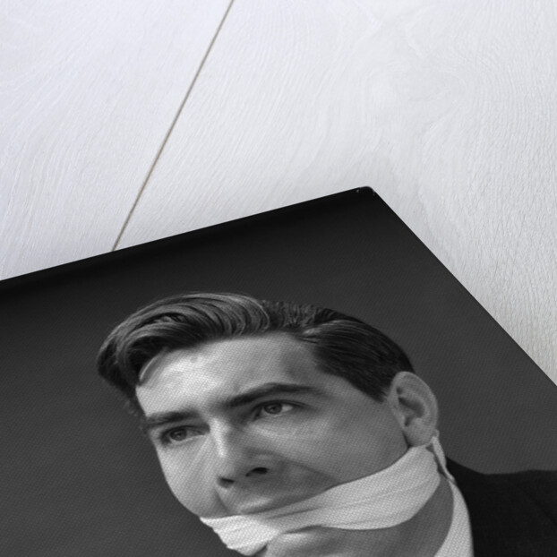 1930s Portrait Of Man With Gag In Mouth by Anonymous