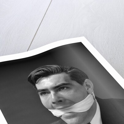 1930s Portrait Of Man With Gag In Mouth by Anonymous