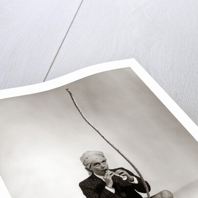 1960s Man Snake Charmer Character In Turban Plaid Jacket Shorts Knee Socks by Anonymous