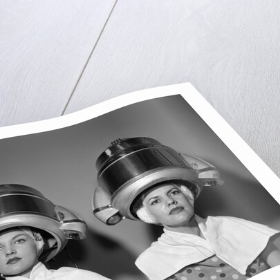 1950s Two Women Under Hair Dryers Towels Around Shoulders Hair Nets by Anonymous