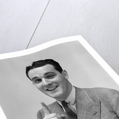 1940s Man In Suit Holding Up Index Finger Making A Point by Anonymous