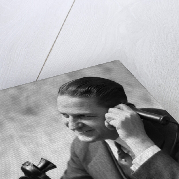 1920s Businessman Talking Into Candlestick Telephone by Anonymous