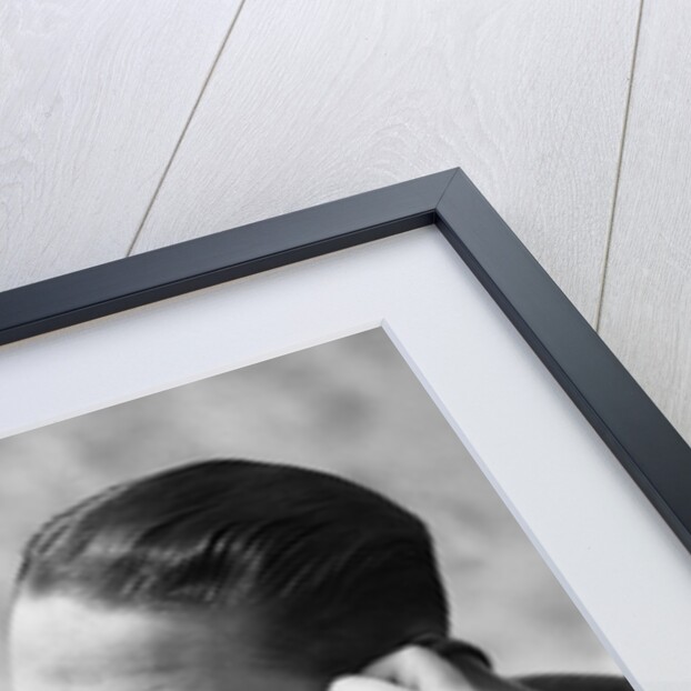 1920s Businessman Talking Into Candlestick Telephone by Anonymous