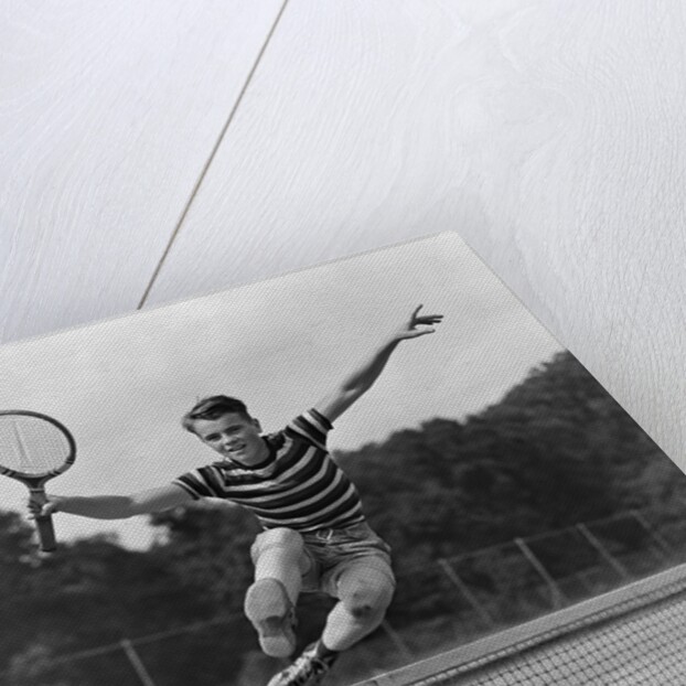 1930s Teenage Boy Tennis Player Jumping Net With Racket In Hand by Anonymous