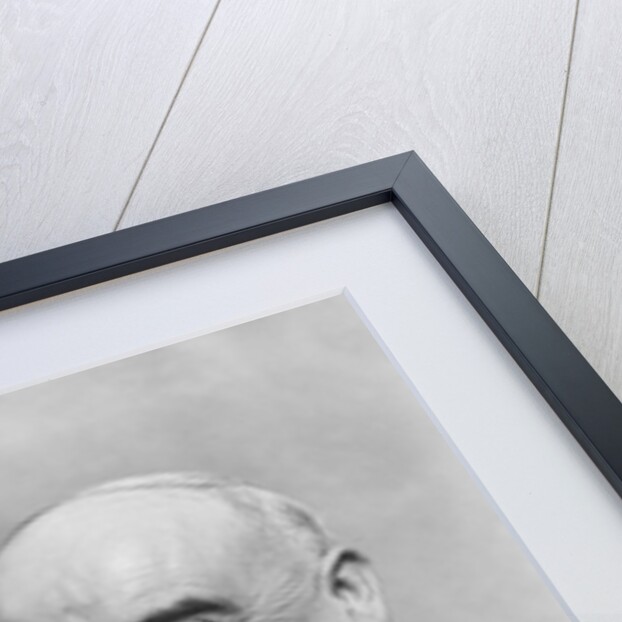 1930s Elderly Businessman In 3-Piece Suit and Glasses Leaning Back With Cigar In Hand by Anonymous