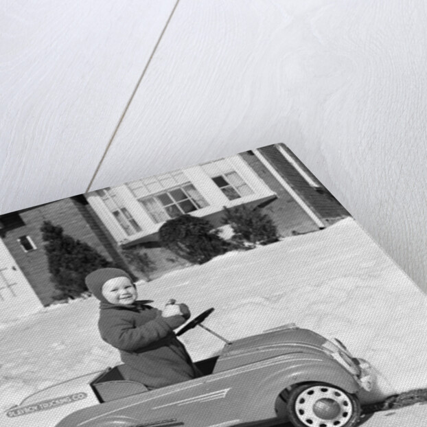 1930s 1940s Little Boy Playing In Toy Car Outside In Snow by Anonymous