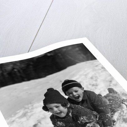 1930 1930s Boy And Girl Laughing Sledding In Snow by Anonymous
