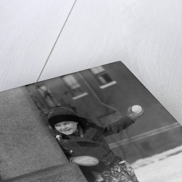 1930s Boy Peeking Around Side Building Throwing A Snowball Winter by Anonymous