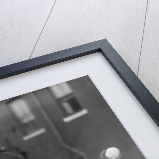 1930s Boy Peeking Around Side Building Throwing A Snowball Winter by Anonymous