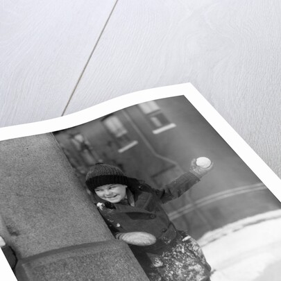 1930s Boy Peeking Around Side Building Throwing A Snowball Winter by Anonymous