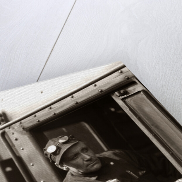 1920s 1930s 1940s Railroad Train Engineer Looking Out Window Of Locomotive Cab Driving The Steam Engine by Anonymous