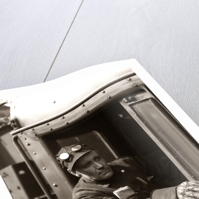 1920s 1930s 1940s Railroad Train Engineer Looking Out Window Of Locomotive Cab Driving The Steam Engine by Anonymous
