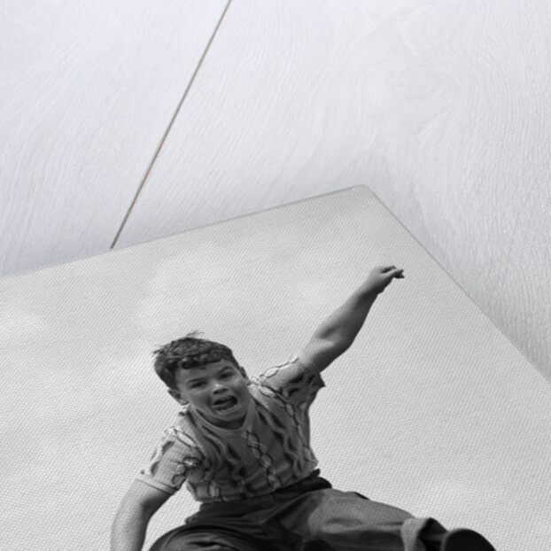 950s Boy Jumping Up by Anonymous
