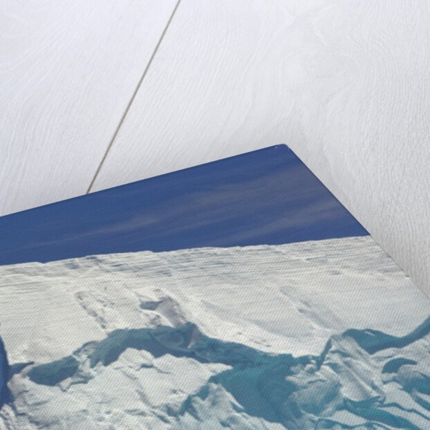 Pointy Blue Iceberg Sculpted by Waves by Anonymous
