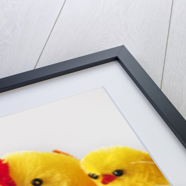 Toy chickens looking at chocolate eggs by Anonymous