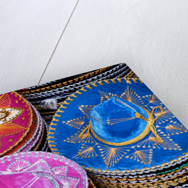 Stacks of souvenir sombreros by Anonymous