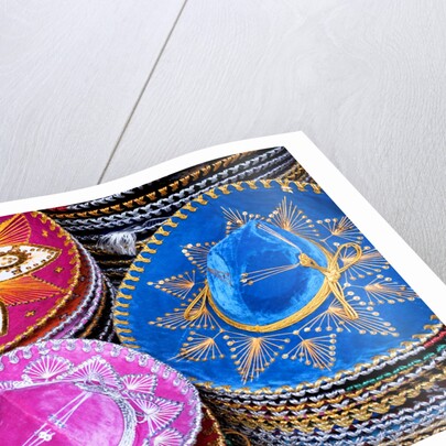 Stacks of souvenir sombreros by Anonymous