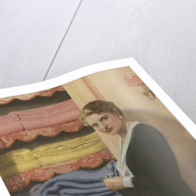 Woman puting away blanket in linen closet by Anonymous