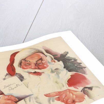 Santa Claus reading letter by Corbis