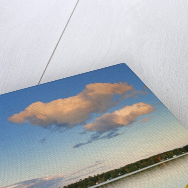 Clouds reflected in Silent Lake with Muskoka chair on dock by Anonymous