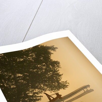 Adirondack chair on dock by Anonymous