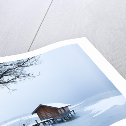 Snow covered pier and boat house at Lake Starnberg by Anonymous