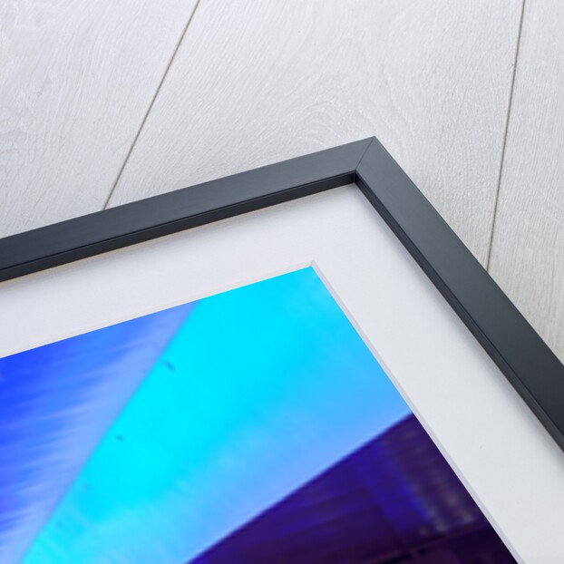 Traffic beneath neon-lit elevated road by Anonymous