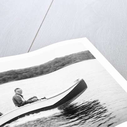 Two brothers speed by in a motor boat on a Wisconsin lake, ca. 1956 by Anonymous