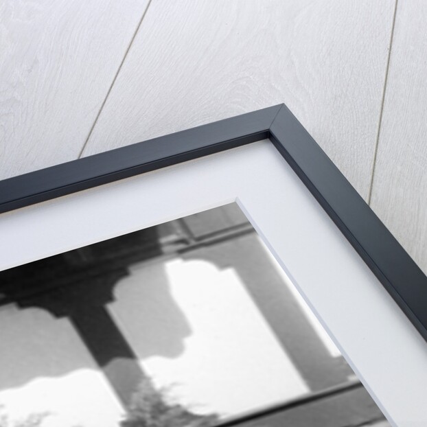 A father show his two year old daughter how to mow the lawn, ca. 1956 by Anonymous