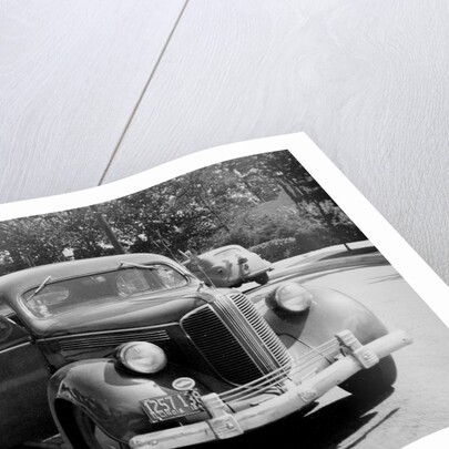 Eighteen year old boy with his first car, ca. 1944 by Anonymous