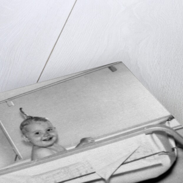 One year old baby girl enjoys her bath, ca. 1953 by Anonymous