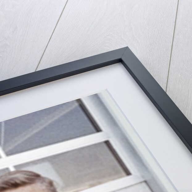 Fifteen year old high school football player portrait outside the school, ca. 1961 by Anonymous