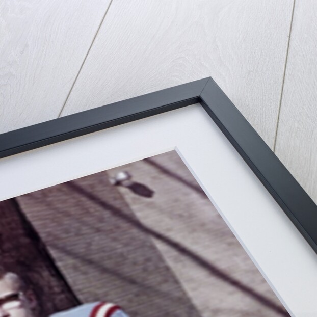 Fifteen year old high school football player portrait outside the school, ca. 1961 by Anonymous