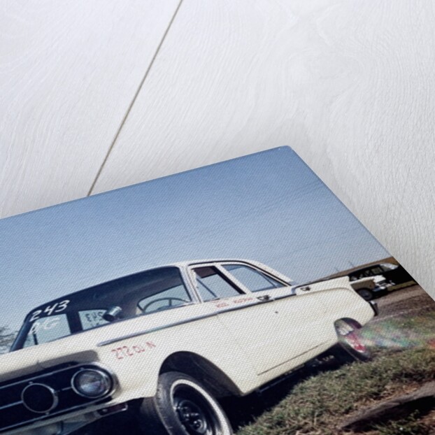 Sixteen year old boy stands with his 1960 Mercury Comet automobile, ca. 1962 by Anonymous