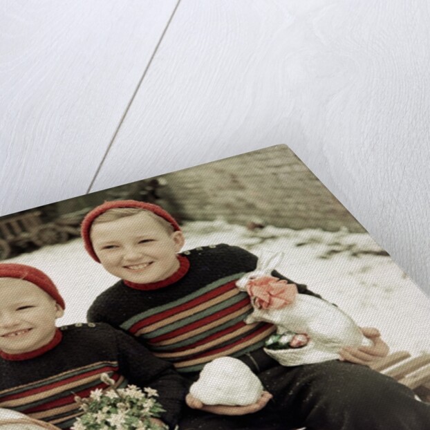Two brothers sit with Easter decorations outside in Germany, ca. 1948 by Anonymous