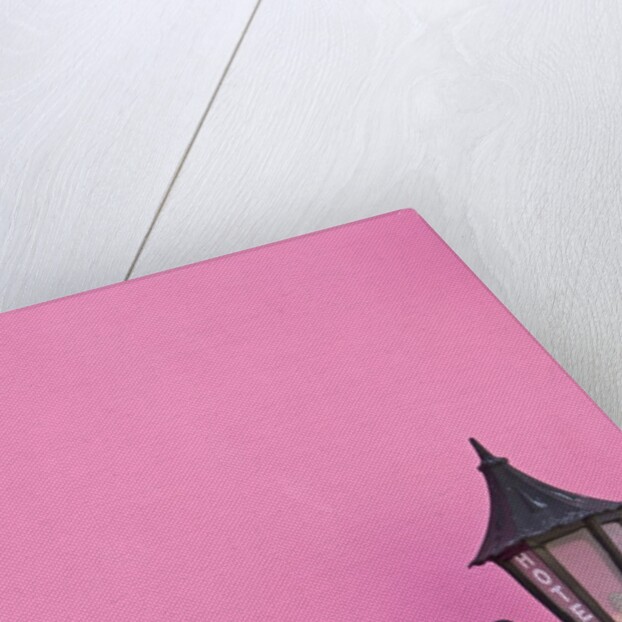 Street lamp on pink wall of Colonial style building by Anonymous