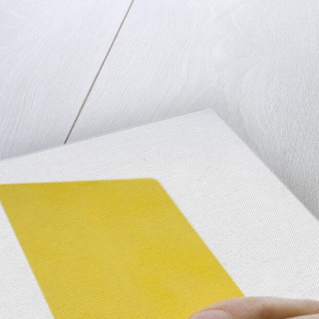 Hand holding yellow card by Anonymous